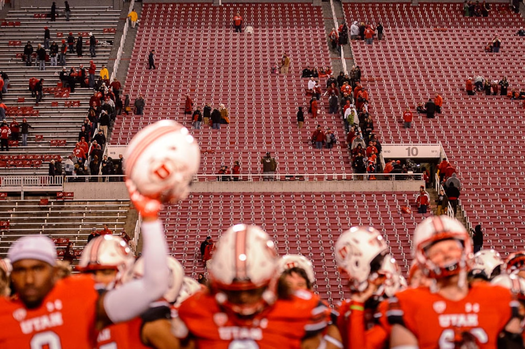 (Trent Nelson | The Salt Lake Tribune)  Rice-Eccles Stadium nearly empty of fans as Utah players sing "Utah Man" after the loss, as the University of Utah hosts Washington State, NCAA football in Salt Lake City, Saturday November 11, 2017.