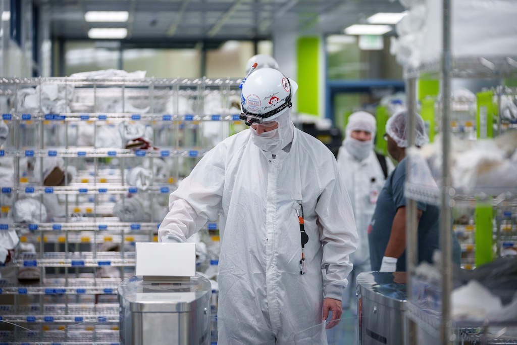 (Trent Nelson  |  The Salt Lake Tribune) Workers dress to enter a clean room at Texas Instruments' semiconductor fabrication facility in Lehi on Thursday, Nov. 2, 2023.