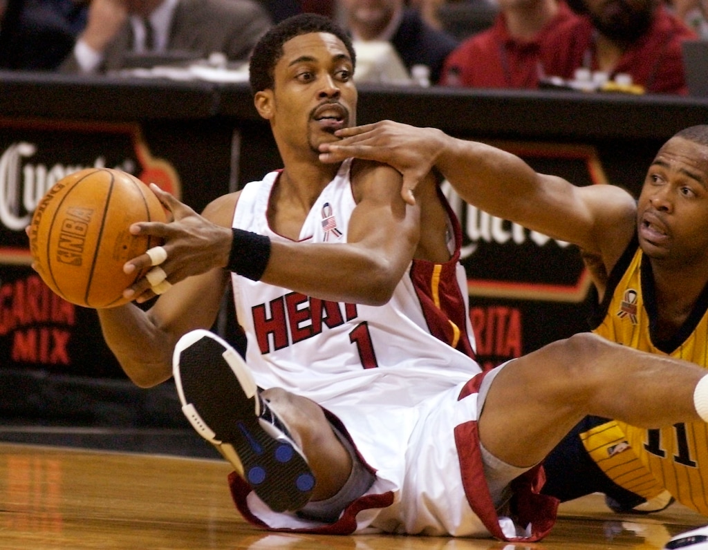(David Friedman | AP) Miami Heat's Rod Strickland, left, looks to pass after falling to the floor with Indiana Pacers' Jamaal Tinsley, right, in the first half at American Airlines Arena in Miami on Friday, March 22, 2002.