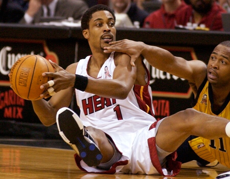 (David Friedman | AP) Miami Heat's Rod Strickland, left, looks to pass after falling to the floor with Indiana Pacers' Jamaal Tinsley, right, in the first half at American Airlines Arena in Miami on Friday, March 22, 2002.