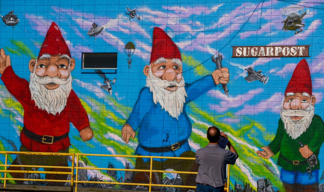 (Leah Hogsten | The Salt Lake Tribune) Craig Goodman takes a photo of the mural by artist Josh Sheuerman located at Sugarpost Metal during the 2nd annual Mural Fest sponsored by South Salt Lake Arts Council and Utah Arts Alliance. Ten murals were created in South Salt Lake's community between 2100 and 2400 South off of West Temple, May 11, 2019.
