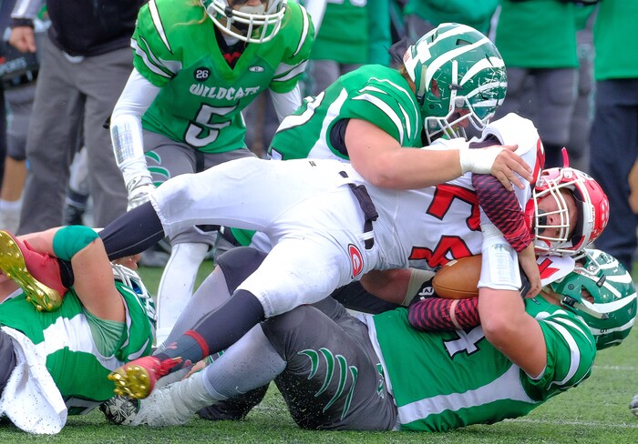 (Leah Hogsten  |  The Salt Lake Tribune)  Grand's Dante Wells runs into the wall of South Summit defense.   South Summit High School boys' football team leads Grand County High School 34-3 during their class 2A state semifinal football game Saturday, November 4, 2017 at Weber State University's Stewart Stadium.