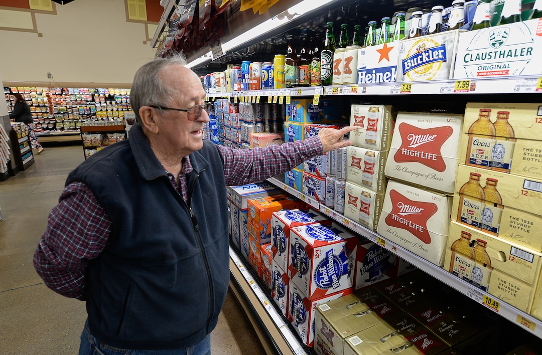 (Francisco Kjolseth  |  The Salt Lake Tribune)  Duane Olsen points out some of his favorite beer brands as he visits the beer isle at Smith's Marketplace in Bountiful filled with the new beer that is 5% alcohol by volume on Friday, Nov. 1, 2019, for the first time in 86 years.