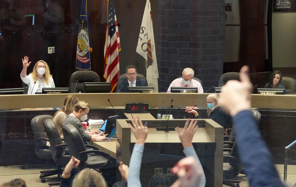 (Francisco Kjolseth | The Salt Lake Tribune) Salt Lake County council member Laurie Stringham tries to maintain order as people react to comments made by council member Dea Theodore inside the Salt Lake County Government Center chamber on Tuesday, Jan. 11, 2022, where some were protesting the recent mask mandate issued by the Salt Lake County Health Department and Mayor Jenny Wilson.