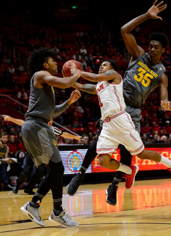 (Steve Griffin  |  The Salt Lake Tribune) Utah Utes guard Justin Bibbins (1) gets knocked around bye the Arizona State defense during the Utah Utes versus Arizona State Sun Devils at the Huntsman Center on the University of Utah campus in Salt Lake City Sunday January 7, 2018.
