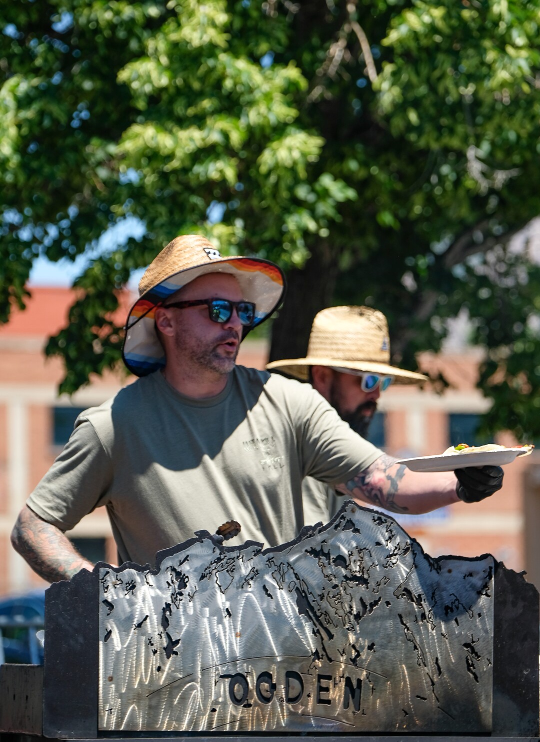(Francisco Kjolseth  |  The Salt Lake Tribune)  Brian Zinsmann, left, of Wimpy and Fritz serves up tacos al pastor as the Ogden Arts Festival brings local and regional artists, creatives and entertainers to Ogden, UT on June 8th and 9th. The Ogden Arts Festival returned to the historic Union Station located in the heart of downtown. Managed by Nurture the Creative Mind and held as a fundraiser for the organization, the event was complete with artist booths, music, theater, kidÕs activities, urban arts area, skateboarding games and artisan food vendors.