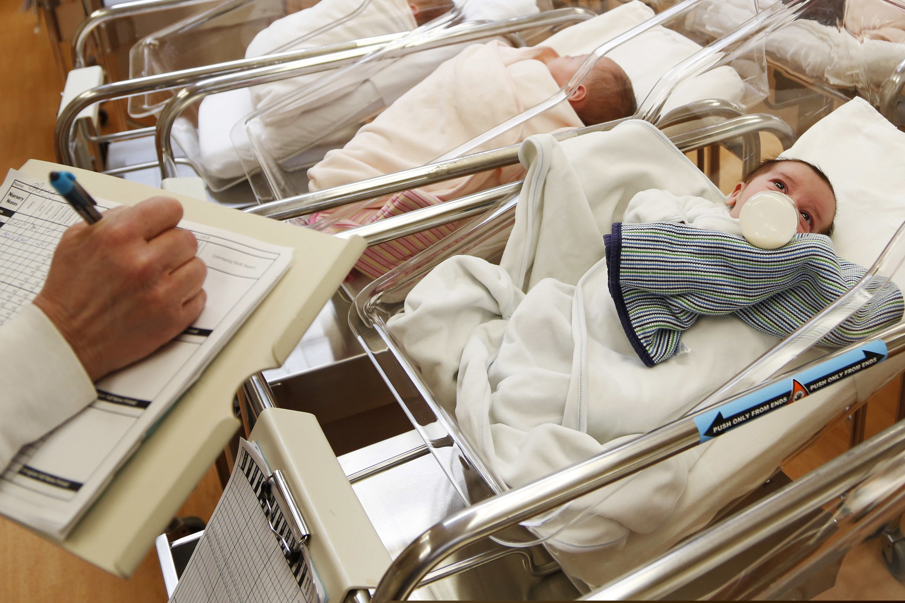 (Seth Wenig | AP file photo) Newborn babies rest in the nursery of a postpartum recovery center in upstate New York. According to a government report released Wednesday, May 15, 2019, U.S. birth rates reached record lows for women in their teens and 20s, leading to the fewest babies in 32 years.
