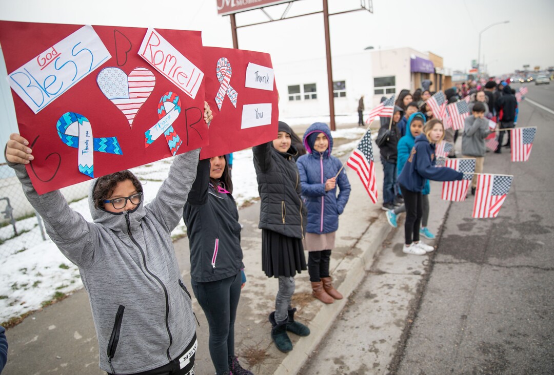 (Keith Johnson  |  special to The Salt Lake Tribune) Students and staff from Granite Park Jr. High line State Street near 3000 South to watch the funeral procession for Officer David Romrell Dec. 5, 2018 in South Salt Lake, Utah. Officer Romrell, a South Salt Lake police officer, was killed in the line of duty Nov. 24th when he was struck by a car driven by a fleeing suspect. 
