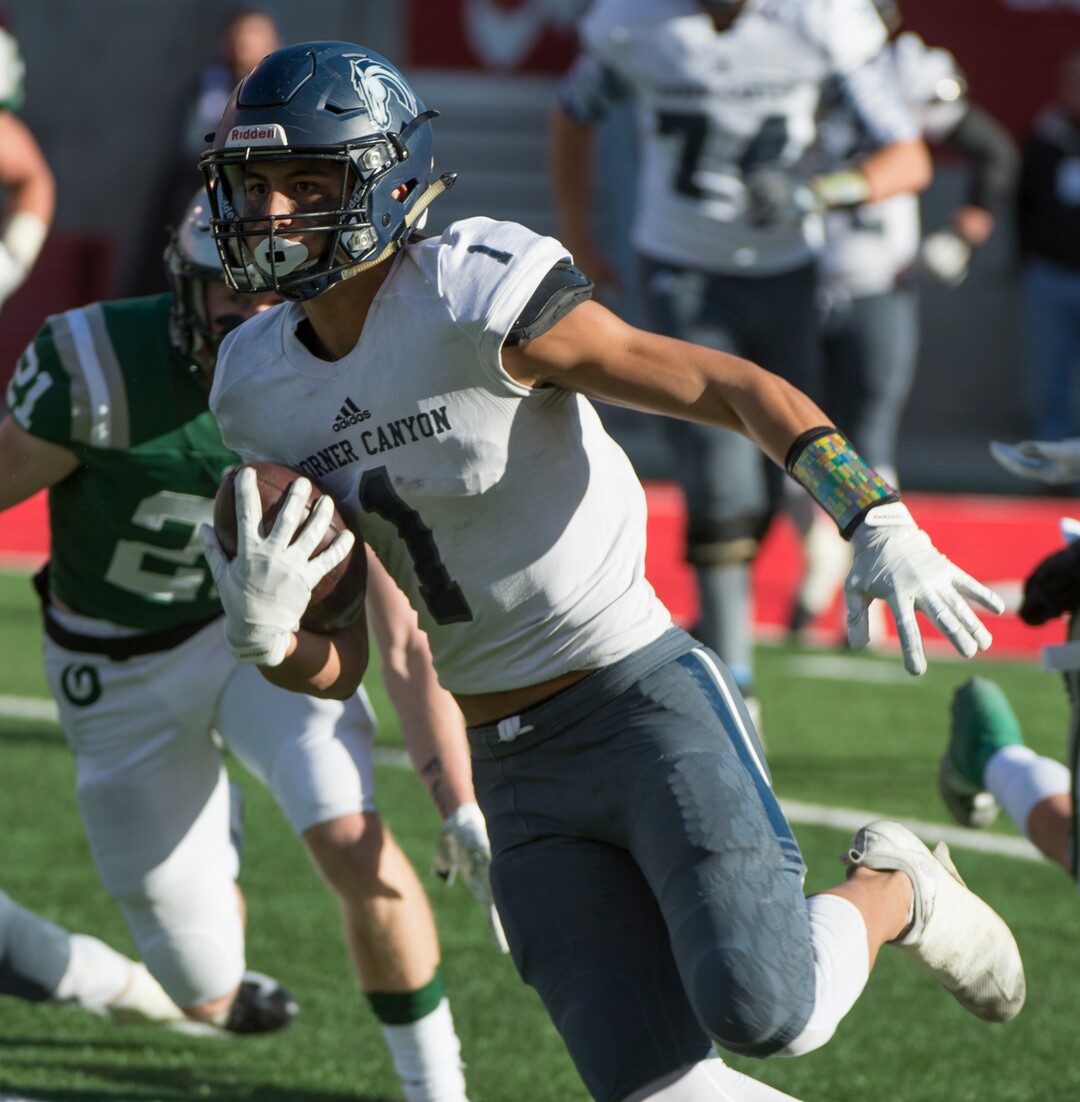 (Rick Egan  |  The Salt Lake Tribune)    John Mitchell (1) runs the ball for Corner Canyon, in 5A football semifinal action between Olympus and Corner Canyon at Rice-Eccles Stadium, Thursday, Nov. 8, 2018.
