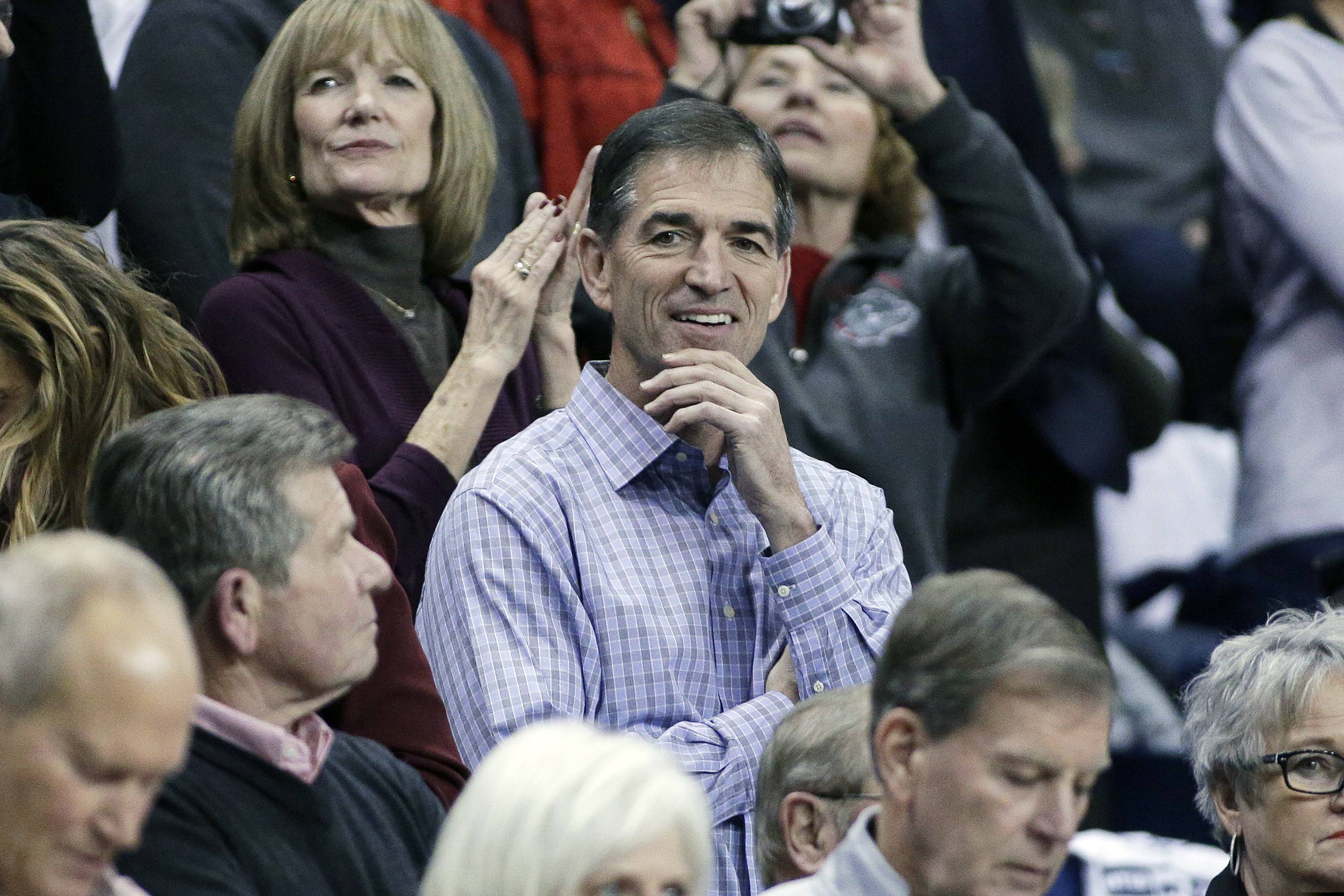 FILE - In this Dec. 7, 2016, file photo, retired NBA player and Gonzaga alumnus John Stockton, center, looks on before an NCAA college basketball game between Gonzaga and Washington in Spokane, Wash. John Stockton is the father of Gonzaga women's basketball player Laura Stockton. (AP Photo/Young Kwak, File)