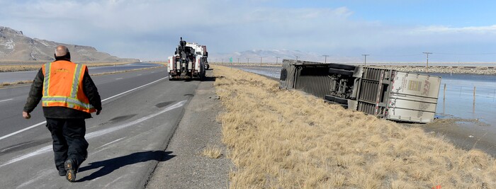 (Al Hartmann  |  The Salt Lake Tribune) 	One of three semi truck trailers that flipped over on I-80  westbound in high winds around 8:00 a.m. Friday March 2.  The incidents happened between mile posts 79 to 82 just east of the Rowley-Dugway exit in Tooele County.   Wrecking crews were kept busy all morning righting the rigs. 