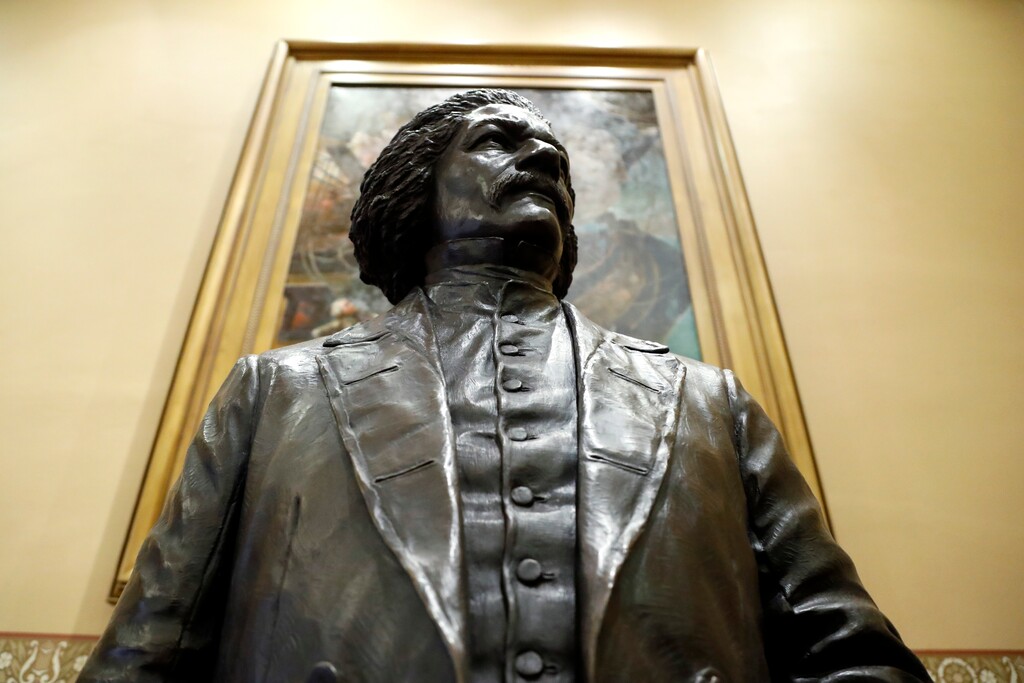 A bronze statue of abolitionist Frederick Douglass at the Maryland State House, Monday, Feb. 10, 2020, in Annapolis. (AP Photo/Julio Cortez)
