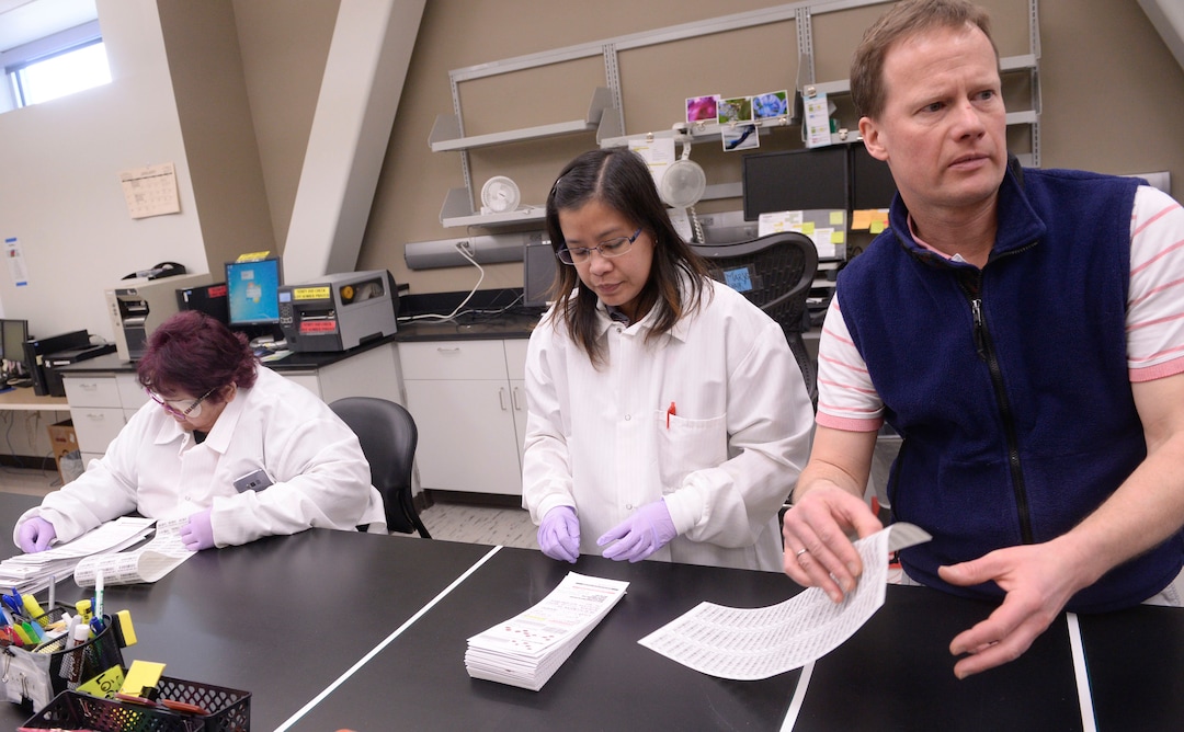 Al Hartmann  |  The Salt Lake Tribune  Laboratory technicians Julie Walker, left, and Michelle Quitugua organize the day's babys blood samples for testing at the Utah Public Health Laboratory.  Andy Rohrwasser, right, directs the newborn screening lab.  The Utah Department of Health announced they're going to start testing every infant born in the state for spinal muscular atrophy. The neurodegenerative disease is the leading genetic cause of death for infants, affecting one in 11,000.  