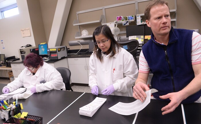 Al Hartmann  |  The Salt Lake Tribune  Laboratory technicians Julie Walker, left, and Michelle Quitugua organize the day's babys blood samples for testing at the Utah Public Health Laboratory.  Andy Rohrwasser, right, directs the newborn screening lab.  The Utah Department of Health announced they're going to start testing every infant born in the state for spinal muscular atrophy. The neurodegenerative disease is the leading genetic cause of death for infants, affecting one in 11,000.  