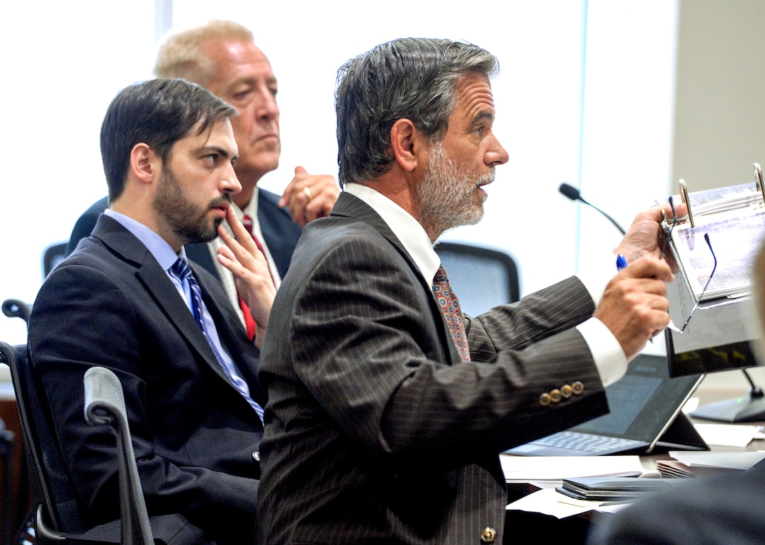 (Leah Hogsten  |  The Salt Lake Tribune)  Robert Lyman, center, sits with his defense attorneys, Andrew Deiss, right and Corey D. Riley, left. Lyman was bound over for trial and pleaded not guilty to charges of reckless burning and burning during a closed fire season before Judge James Brady in Fourth District Court in Provo, Utah, July 30, 2019. Lyman is accused of starting the June 17, 2017 that burned 71,000 acres and cost an estimated $35 million to fight.Ê