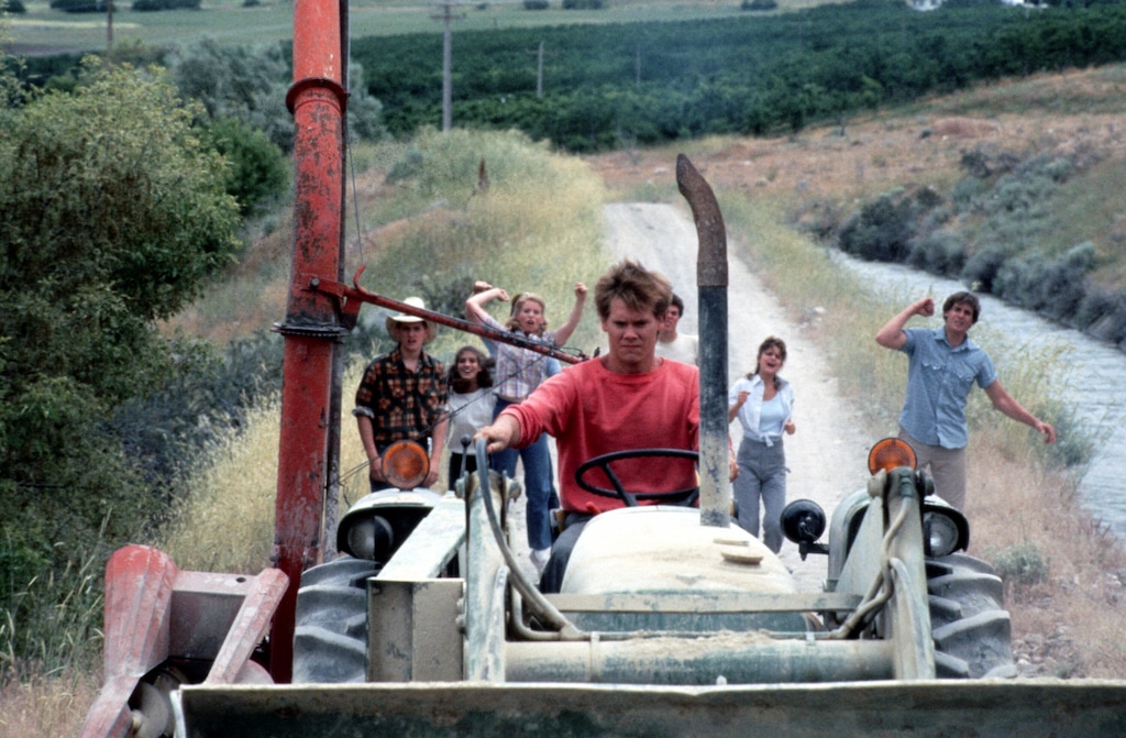 (Paramount Pictures) Ren (Kevin Bacon) drives a tractor in a scene from the 1984 movie "Footloose," which was filmed in Utah County. Bacon announced on March 22, 2024 that he will return to the school for their prom before the building is torn down.