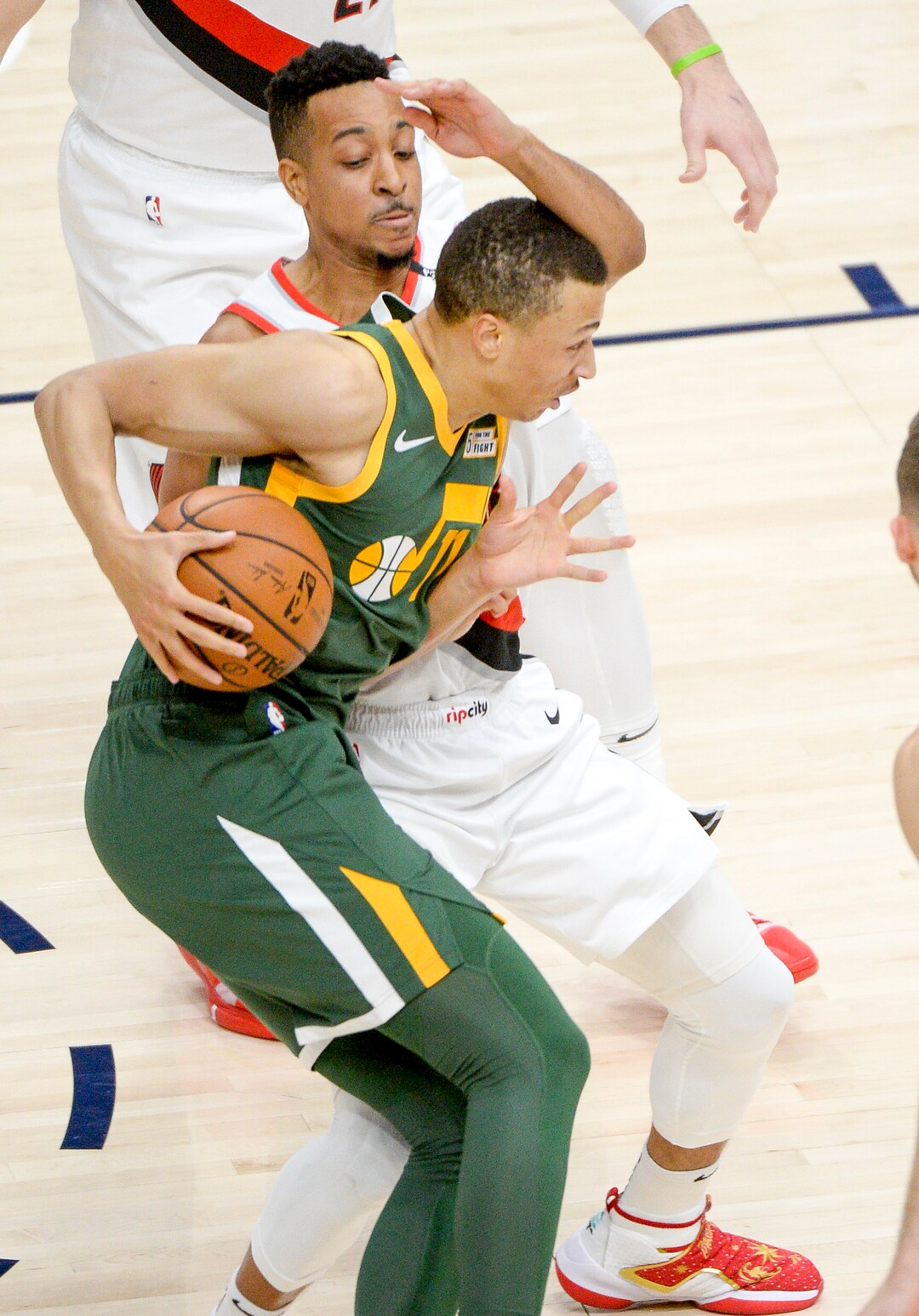 Leah Hogsten  |  The Salt Lake Tribune  Utah Jazz guard Dante Exum (11) collides with Portland Trail Blazers guard CJ McCollum (3) as the Utah Jazz host the Portland Trail Blazers Christmas night at Vivint Smart Home Arena.