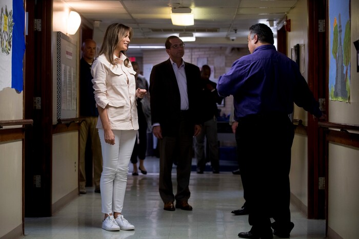 First lady Melania Trump, left, and Health and Human Services Secretary Alex Azar, center, take a tour of the Upbring New Hope Children Center run by the Lutheran Social Services of the South in McAllen, Texas, Thursday, June 21, 2018. (AP Photo/Andrew Harnik)