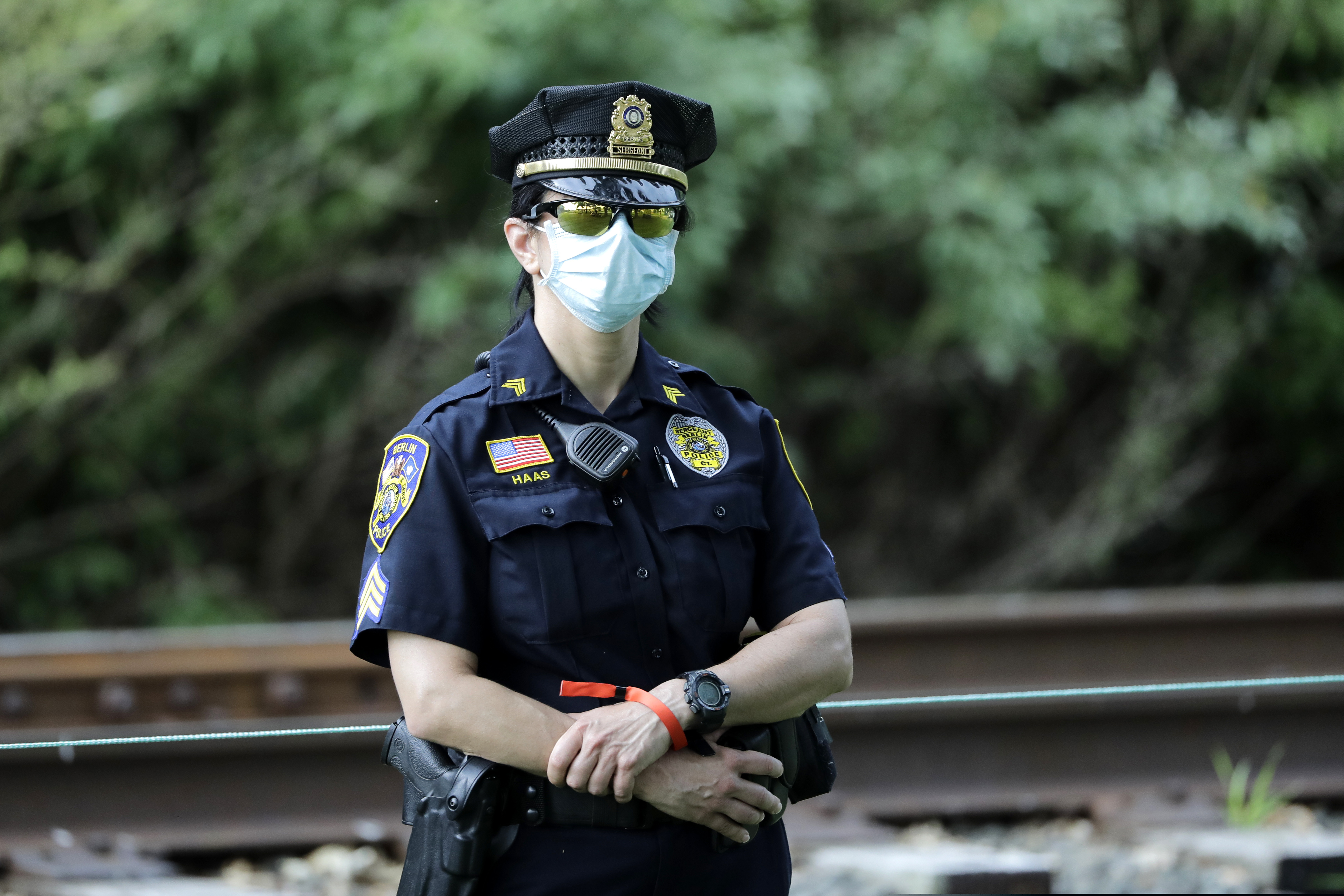 (Frank Franklin II | AP file photo)  A police officer wears a face mask to protect agains the new coronavirus at TPC River Highlands, Sunday, June 28, 2020, in Cromwell, Conn.