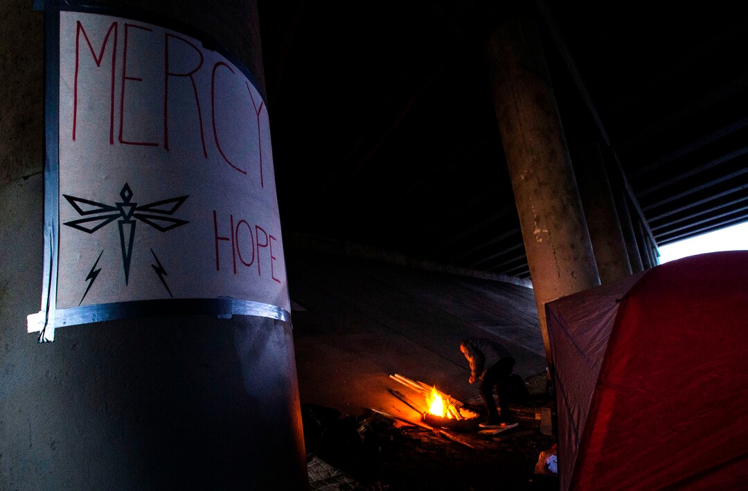 (Rick Egan | The Salt Lake Tribune) A poster with Mercy, Hope and the Dragonfly  on the freeway pillars at Camp Last Hope, on Friday, Jan. 1, 2021.