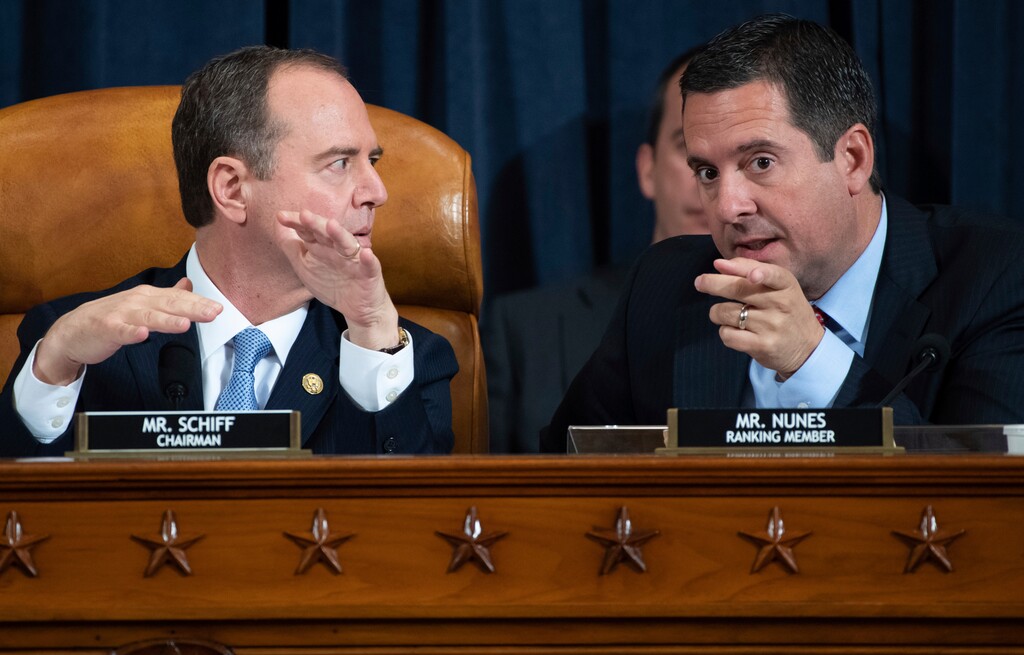 (Saul Loeb | Pool Photo via AP) House Intelligence Committee Chairman Rep. Adam Schiff, D-Calif., left, talks with ranking member Rep. Devin Nunes, R-Calif., during a hearing of the House Intelligence Committee on Capitol Hill in Washington, Wednesday, Nov. 13, 2019, during the first public impeachment hearing of President Donald Trump's efforts to tie U.S. aid for Ukraine to investigations of his political opponents.