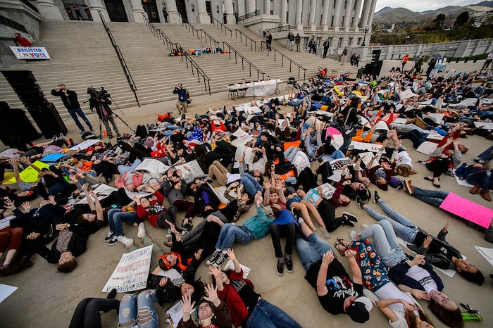 (Trent Nelson | The Salt Lake Tribune)  
High school students staged a die-in at the Utah State Capitol in Salt Lake City to mark the anniversary of the Columbine High School massacre and call for action against gun violence, Friday April 20, 2018.