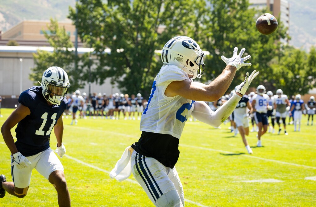 Brayden Cosper attempts a catch in BYU's 2022 fall camp. (Photo by Jaren Wilkey/BYU)