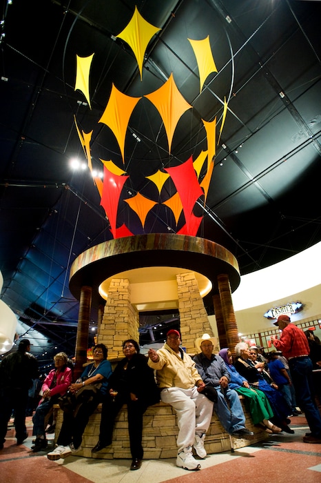 (Cable Hoover | Gallup Independent | The Associated Press) In this Nov. 19, 2008 file photo casino patrons gather around the central foyer of the new Fire Rock Casino near Gallup, N.M.  The city has seen an increase of around 7 to 10 percent in visitors thanks to foreign tourists. Officials believe a favorable exchange rate and increased interest by the media in anything to do with Native culture and crafts led to millions of foreigners vacationing in the United States each summer.