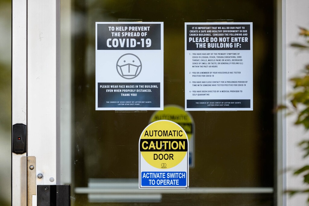 (Trent Nelson  |  The Salt Lake Tribune) A sign at the door of a meetinghouse of The Church of Jesus Christ of Latter-day Saints in Layton requests that people wear masks, on Wednesday, July 15, 2020.