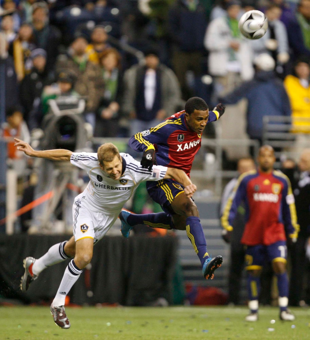 (Trent Nelson  |  Tribune file photo) Real Salt Lake forward Robbie Findley (10, right) and L.A. Galaxy defender Gregg Berhalter fight for the ball during the MLS Cup on Sunday at Qwest Field in Seattle. RSL won the cup 5-4 during the penalty round.
