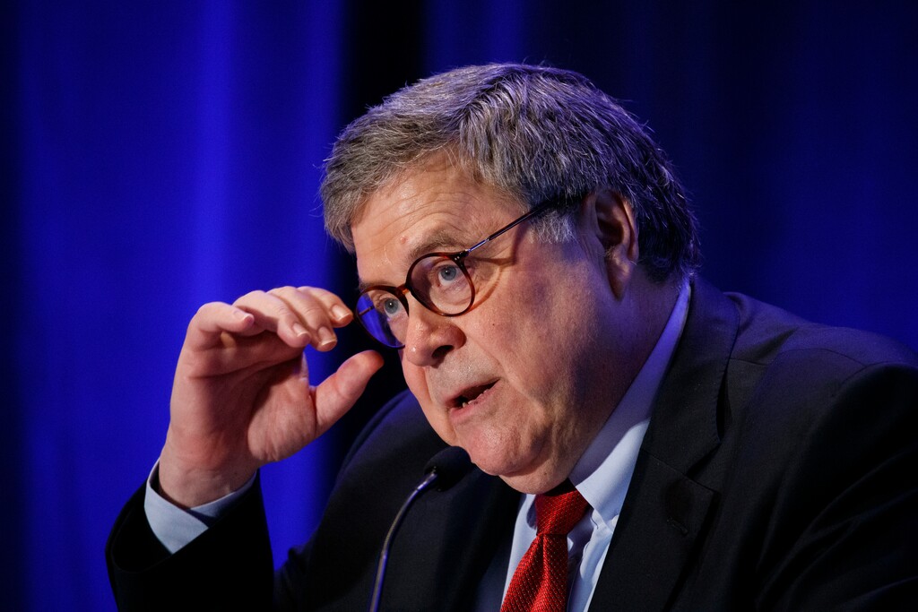 Attorney General William Barr adjusts his glasses while speaking to the National Association of Attorneys General, Tuesday, Dec. 10, 2019, in Washington. (AP Photo/Jacquelyn Martin)