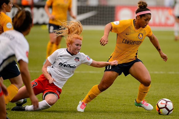 (Trent Nelson | The Salt Lake Tribune)
Utah Royals vs. Washington Spirit, soccer at Rio Tinto Stadium in Sandy, Saturday May 5, 2018. Utah Royals FC midfielder Desiree Scott (11) defended by Washington Spirit midfielder Tori Huster (23).