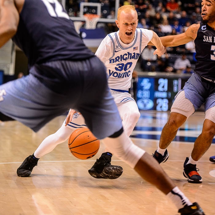 (Trent Nelson | The Salt Lake Tribune)   Brigham Young Cougars guard TJ Haws (30) drives on San Diego Toreros guard Olin Carter III (3) as BYU hosts San Diego, NCAA basketball in Provo Saturday January 20, 2018.