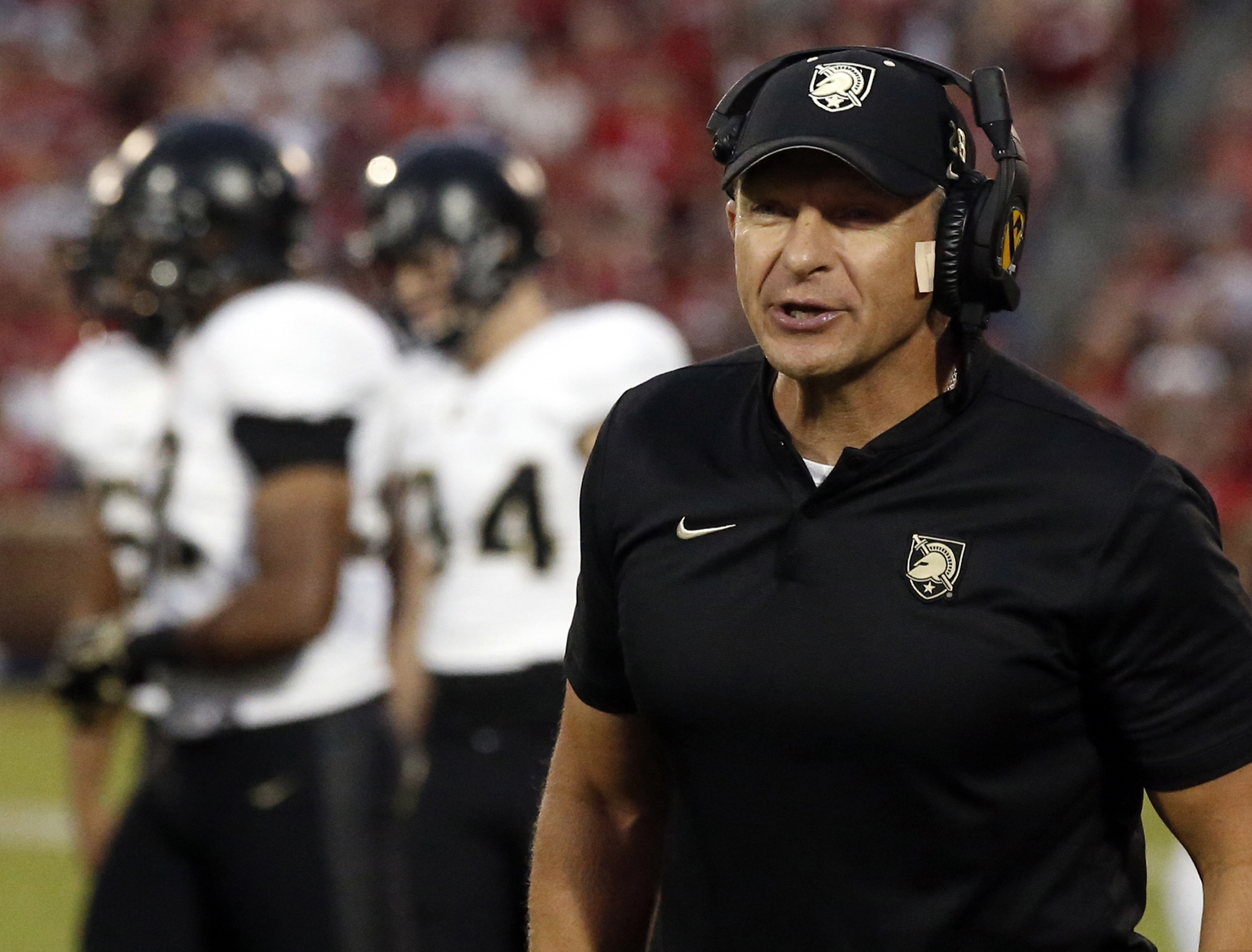 FILE - In this Sept. 22, 2018, file photo, Army head coach Jeff Monken shouts in the first half of an NCAA college football game against Oklahoma in Norman, Okla. College football coaches are facing the daunting challenge of getting their players to maintain the required focus to prepare for season-openers when the prevailing question swirling around the sport is when, or if, the season will even be played because of the worldwide coronavirus pandemic. (AP Photo/Sue Ogrocki, File)