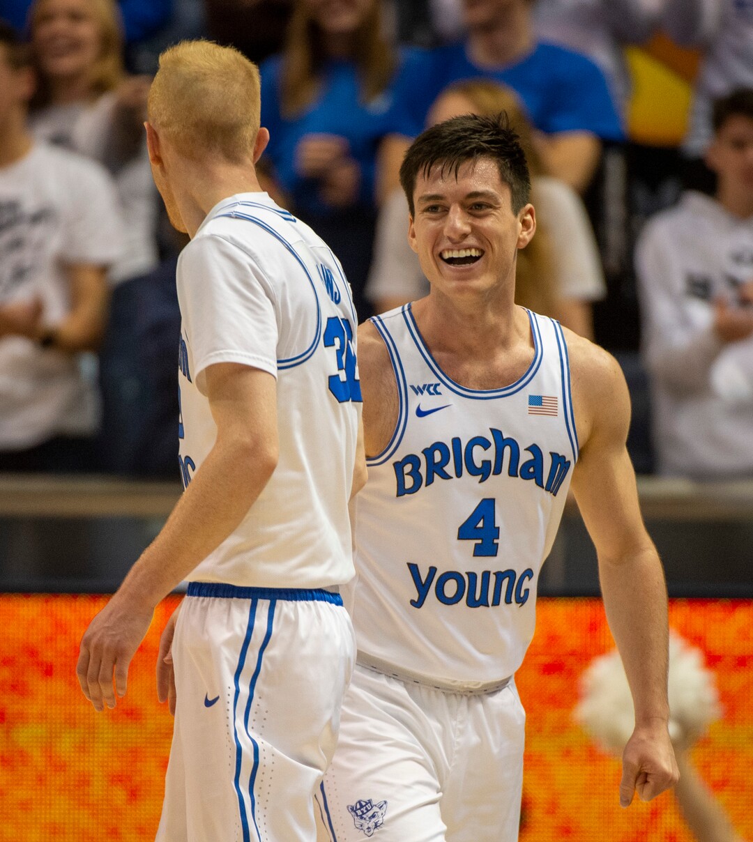 (Rick Egan  |  The Salt Lake Tribune)        Brigham Young Cougars guard Alex Barcello (4) and Brigham Young Cougars guard TJ Haws (30) react after a big play, in basketball action between the Brigham Young Cougars and the Nevada Wolf Pack, at the Marriott Center, in Provo, Saturday, December 10, 2019.