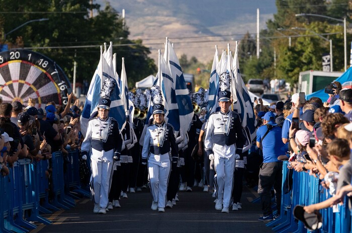 (Francisco Kjolseth | The Salt Lake Tribune) The BYU marching band introduces the football team following close behind before their game against South Florida at LaVell Edwards Stadium in Provo, Saturday, Sept. 25, 2021.