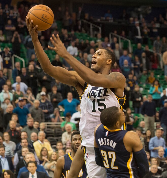 Rick Egan | The Salt Lake Tribune
Utah Jazz forward Derrick Favors (15) goes over the top of Indiana Pacers guard C.J. Watson (32), in for a shot in the final minute of the game, in NBA action, Utah vs Indiana, at EnergySolutions Arena, Monday, January 5, 2015