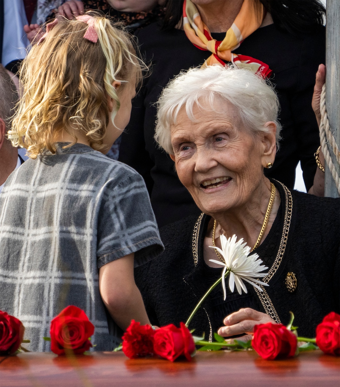 (Rick Egan | The Salt Lake Tribune)  Elaine Hatch receives a flower from her 8-year-old granddaughter, Scout Hoffman, at the interment of her husband, Orrin Hatch, at the Newton Cemetery, in 2022. Elaine Hatch died May 10, 2025, at age 91. 
