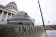 (Bethany Baker  |  The Salt Lake Tribune) The word “Industry” is seen near the flag pole in front of the Utah Capitol in Salt Lake City on Friday, Jan. 2, 2026.