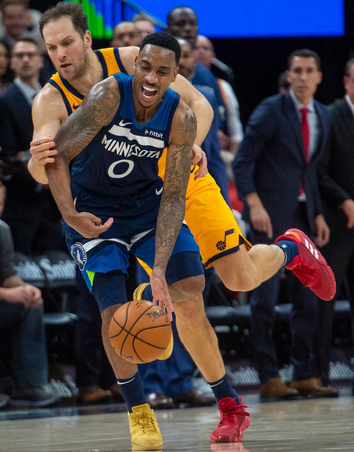 (Rick Egan  |  The Salt Lake Tribune)     Utah Jazz forward Bojan Bogdanovic (44) fouls Minnesota Timberwolves guard Jeff Teague (0), in NBA action between the Utah Jazz and the Minnesota Timberwolves in Salt Lake City, Monday, Nov. 18, 2019.