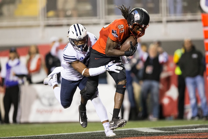 UNLV wide receiver Elijah Trosclair (82) makes a catch for a touchdown against BYU defensive back Dayan Ghanwoloku (5) during an NCAA college football game Friday, Nov. 10, 2017, in Las Vegas. (Erik Verduzco/Las Vegas Review-Journal via AP)