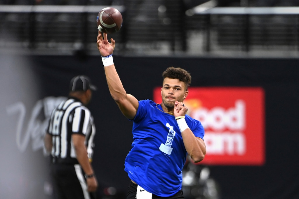 BYU quarterback Jaren Hall warms up before the team's NCAA college football game against Arizona on Saturday, Sept. 4, 2021, in Las Vegas. (AP Photo/David Becker)