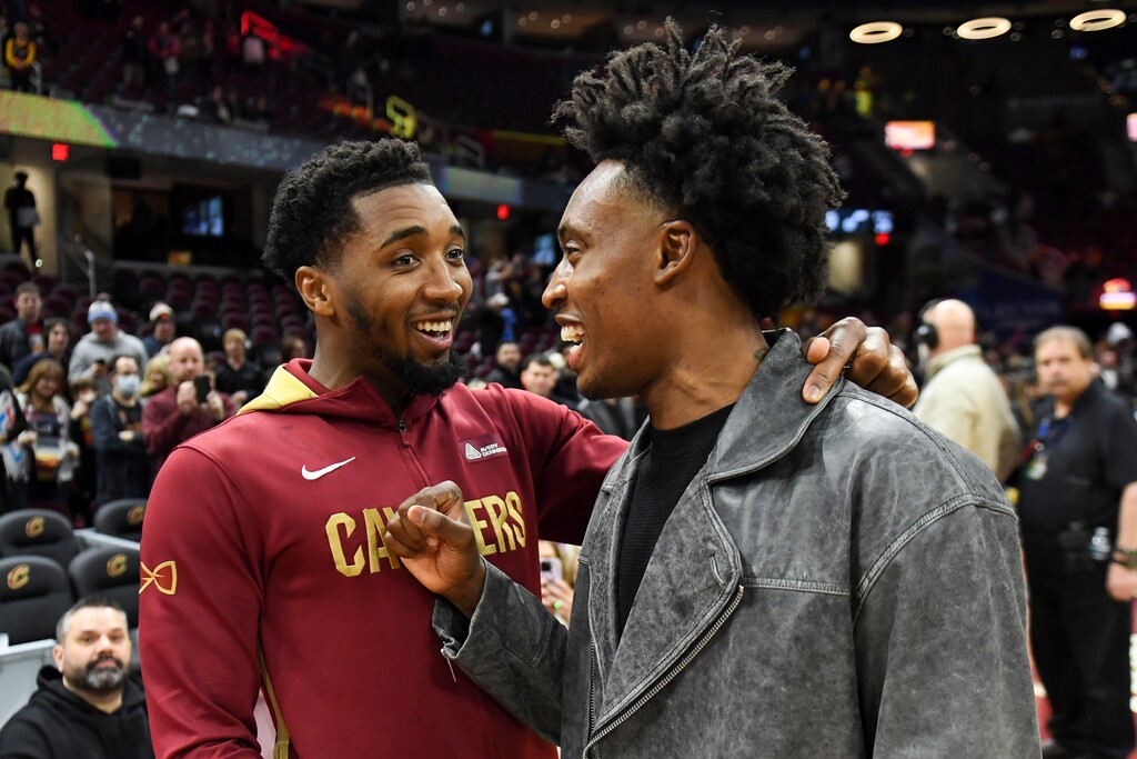 Cleveland Cavaliers guard Donovan Mitchell talks with Utah Jazz guard Collin Sexton after the Cavaliers defeated the Jazz 122-99 in an NBA basketball game, Monday, Dec. 19, 2022, in Cleveland. (AP Photo/Nick Cammett)