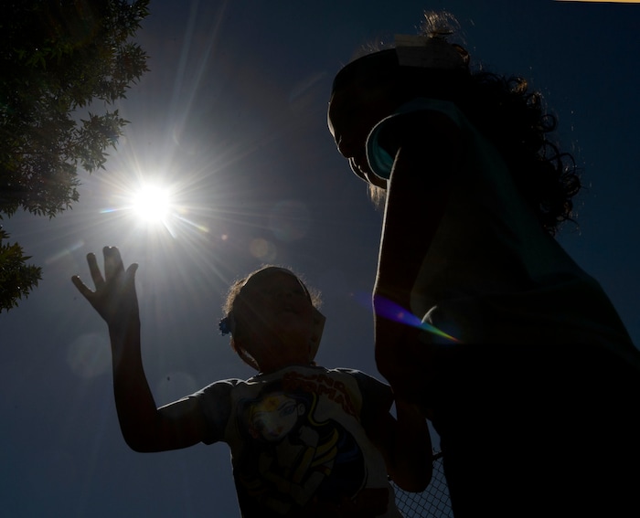 (Steve Griffin  |  The Salt Lake Tribune) Meadowlark Elementary School students watch The Great Eclipse during the Salt Lake School District's first day of the 2017-2018 school year. STEAM teacher-coordinator Wendi Laurence who formerly worked at NASA has been planning an event around the eclipse. All students had glasses to view the event and many had lunch outside at the Salt Lake City school Monday August 21, 2017.