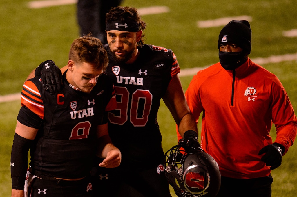 (Trent Nelson  |  The Salt Lake Tribune) Utah Utes quarterback Jake Bentley (8) and Utah Utes defensive end Devin Kaufusi (90) walk off the field as the Utah Utes lose to the USC Trojans, NCAA football at Rice-Eccles Stadium in Salt Lake City on Saturday, Nov. 21, 2020.