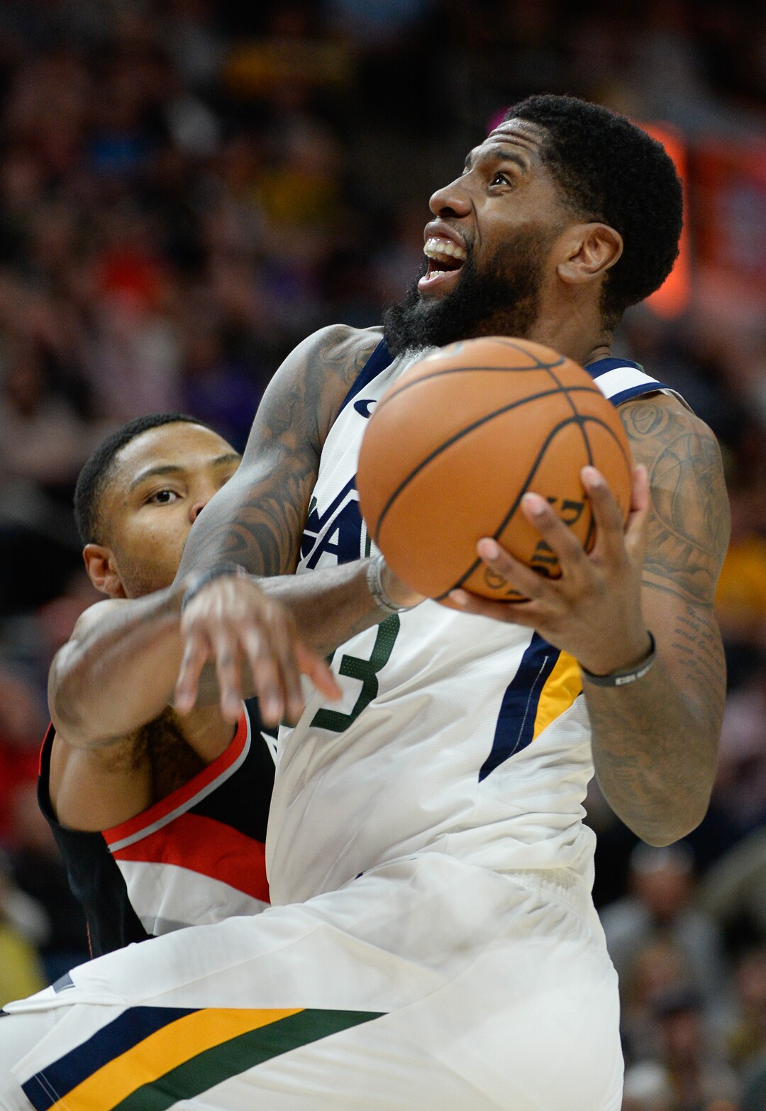 (Francisco Kjolseth  |  The Salt Lake Tribune)  Portland Trail Blazers guard Kent Bazemore (24) tries to reach in to block Utah Jazz forward Royce O'Neale (23) on his way to the basket as the Utah Jazz host the Portland Trailblazers in their NBA basketball game at Vivint Smart Home Arena in Salt Lake City on Wed. Oct. 16, 2019.