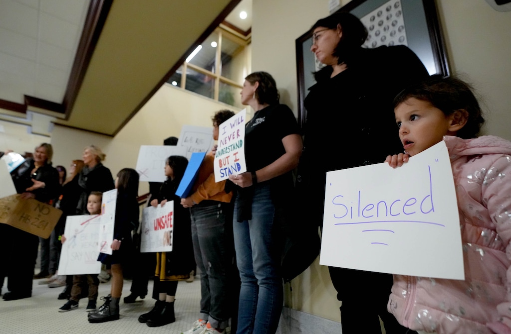 (Francisco Kjolseth | The Salt Lake Tribune) Melarie Wheat is joined by her daughter Brooklyn, 4, as they join others in a silent rally at the Utah Capitol before the Senate Education Committee hears HB261, the anti-DEI bill that would dismantle diversity offices in Utah public education and government, on Monday, Jan. 22, 2024.