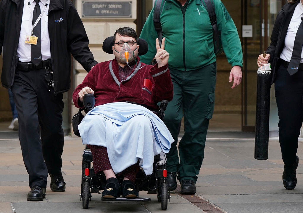 (Andrew Milligan | PA via AP) Nicholas Rossi leaves Edinburgh Sheriff And Justice Of The Peace Court after an extradition hearing, in Edinburgh, Scotland, July 12, 2022. Scottish authorities have signed an extradition order for an American fugitive accused of faking his own death to avoid a rape charge in Utah. A spokesperson for the Utah County District Attorney's office said Rossi had been extradited on Jan. 5, 2024.