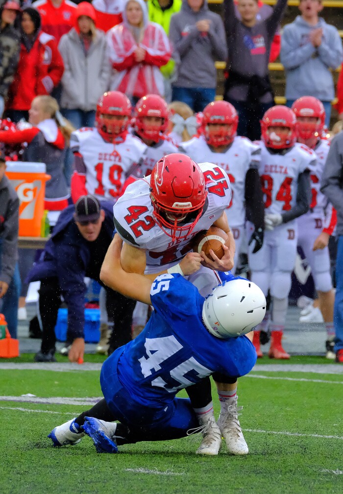 (Leah Hogsten  |  The Salt Lake Tribune) Beaver's Cole Marshall pulls down Delta's Dallin Draper, hurting his ankle on the play. Beaver High School boys' football team defeated Delta High School 35-16 during their class 2A state semifinal football game Saturday, November 4, 2017 at Weber State University's Stewart Stadium.