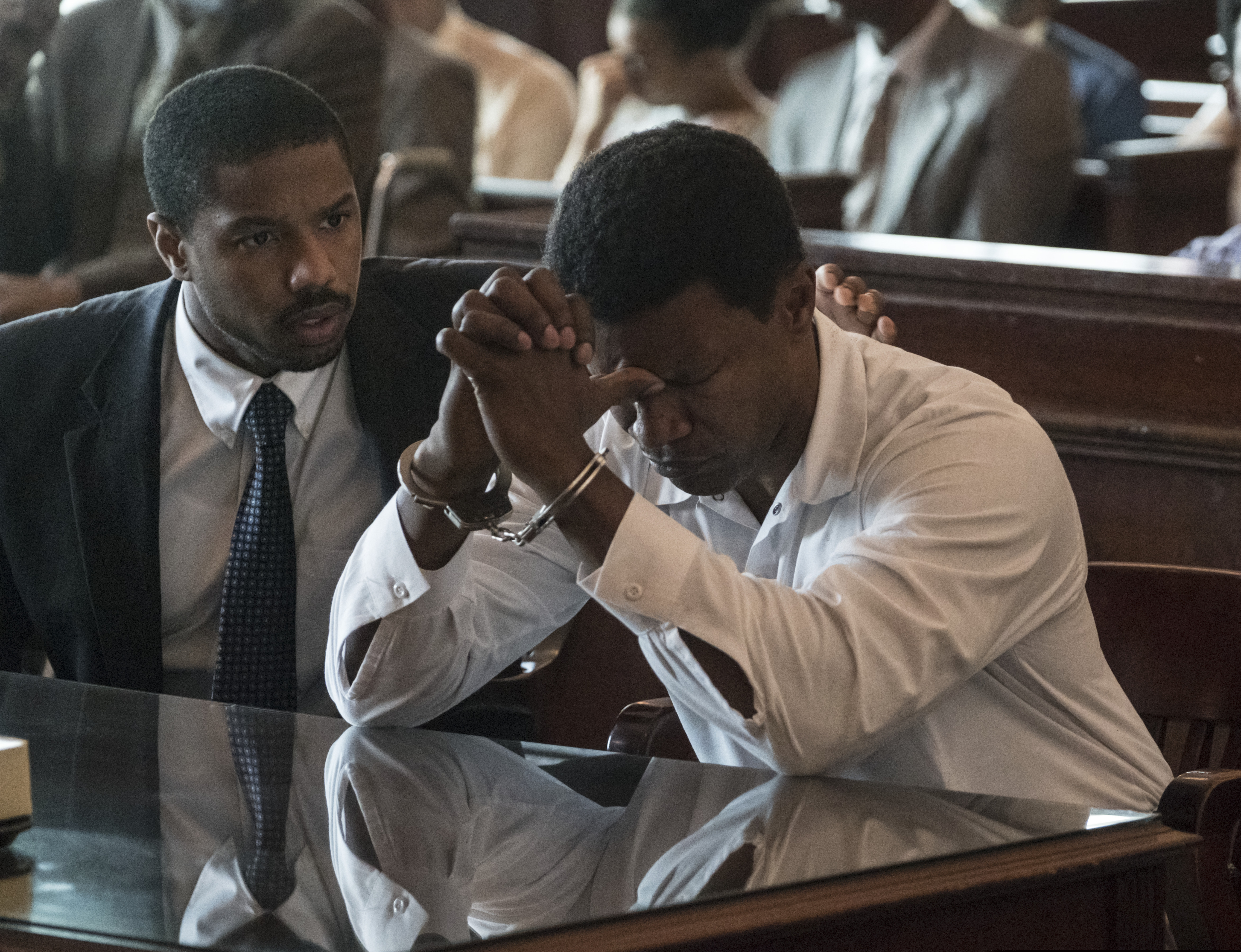 (Jake Netter | Warner Bros. Pictures via AP) This image released by Warner Bros Pictures shows Michael B. Jordan, left, and Jamie Foxx in a scene from "Just Mercy."